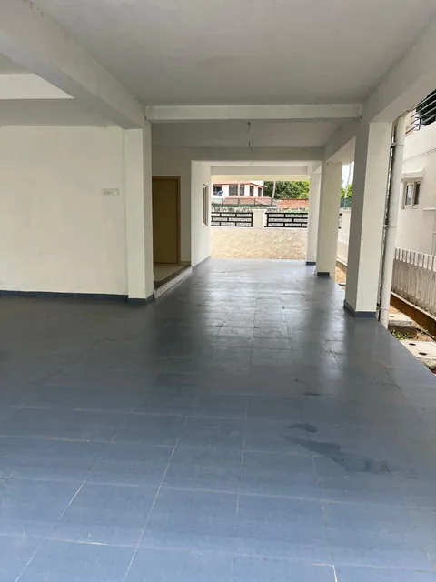 Covered stilt parking extending through the villa footprint