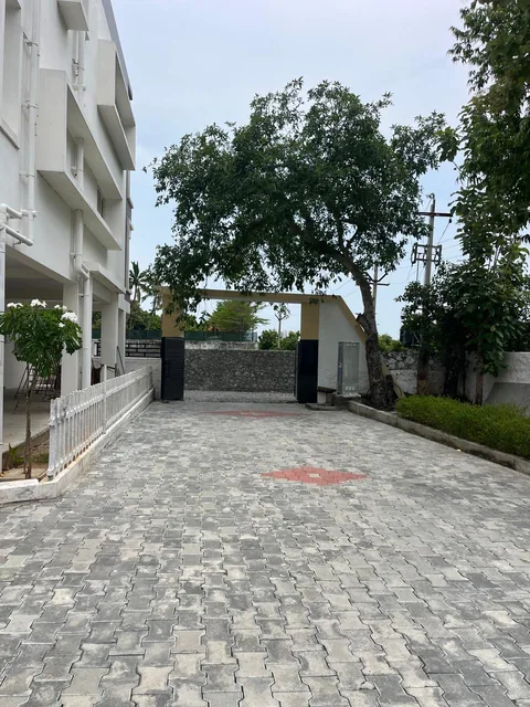The paved internal approach to the community entrance
