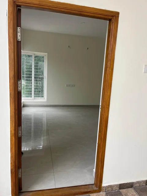 The main doorway opening into the bright, tiled interior