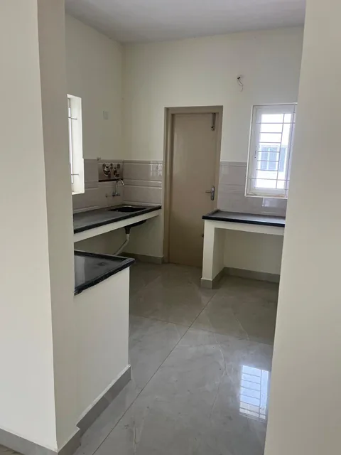 Kitchen with granite worktops, sink and access to the utility area
